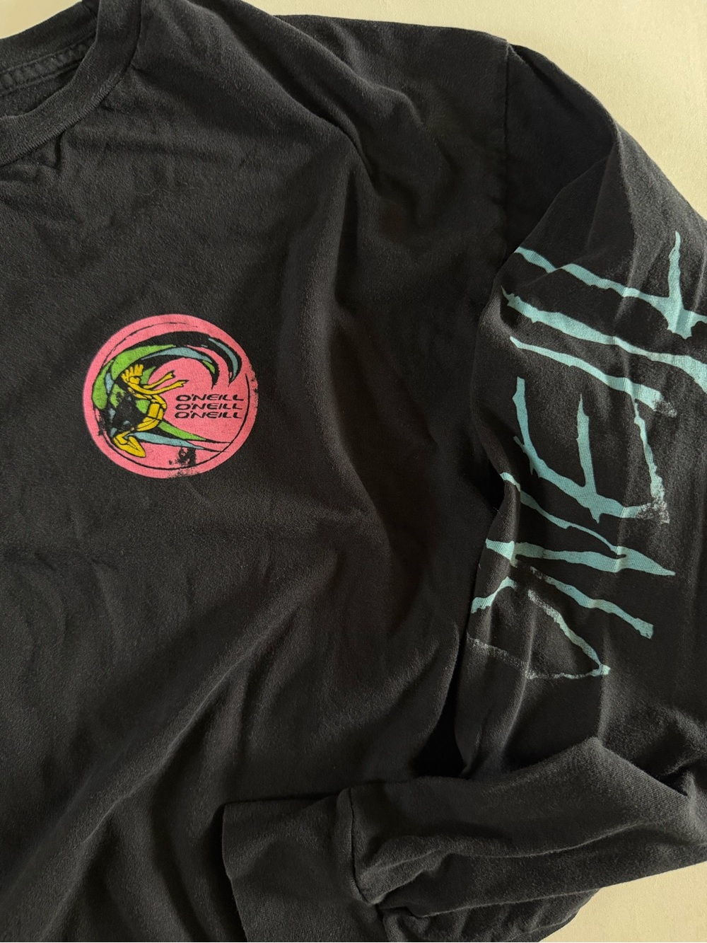 O’Neill Black Long Sleeve Graphic Tee with 80’s classic Pink & Teal Design - Picture 3 of 4